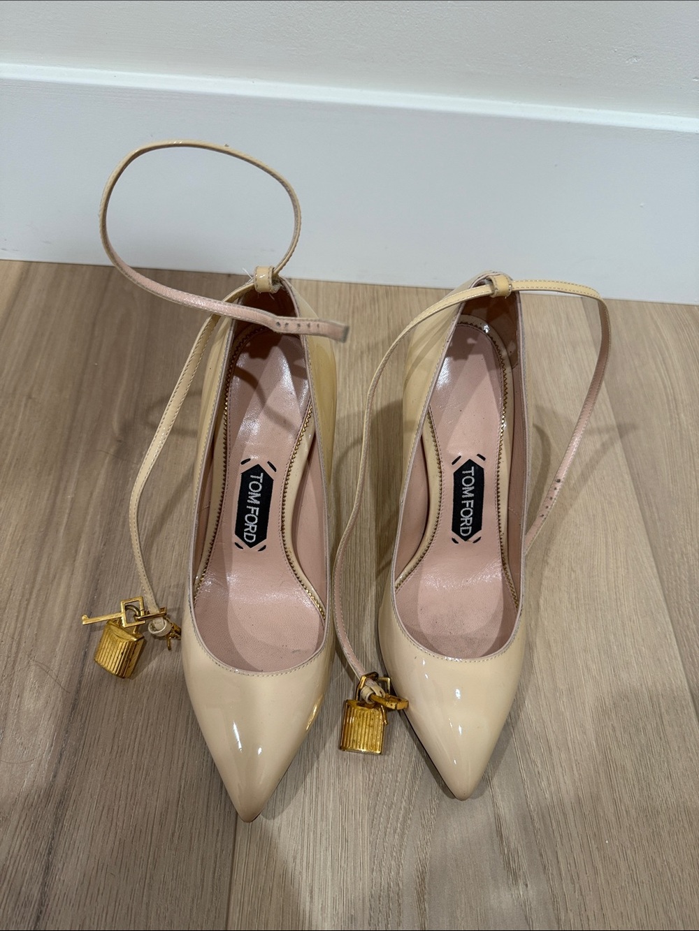 Tom Ford Cream Patent Leather Ankle-Tie Pumps with Gold Padlock Charms
